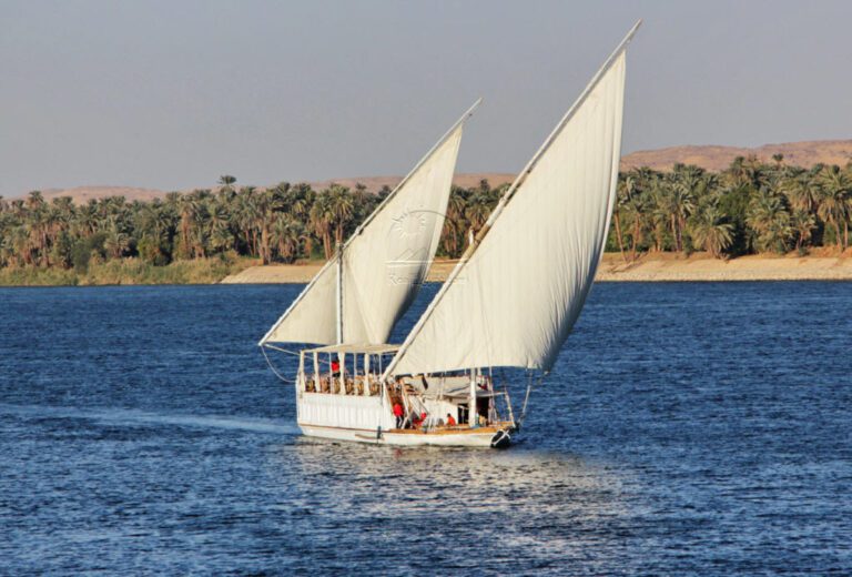 a photo showing the Dahabiya sailing in the middle of the Nile