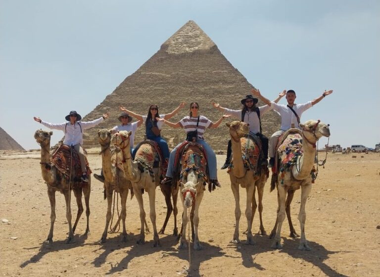 a photo showing a group of people taking a photo in front of the great pyramid of Giza in Egypt