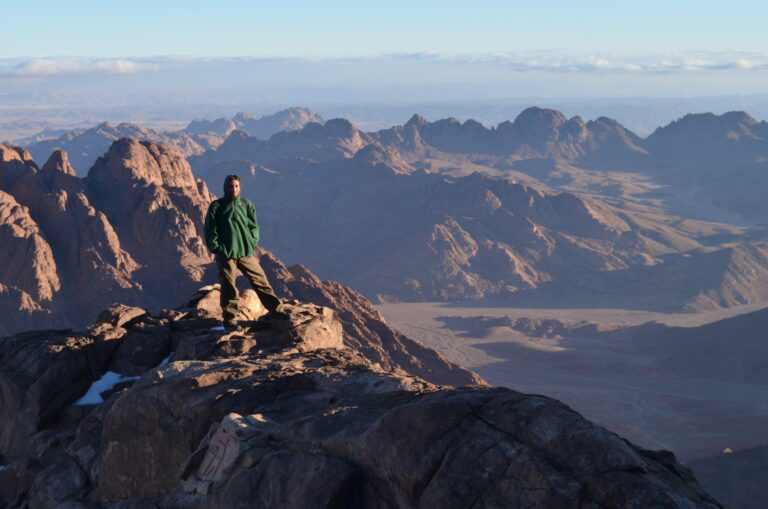 a photo showing a man on top of Saint Catherine mountain (summit)