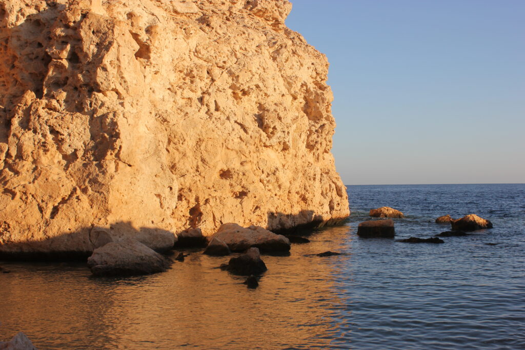 a photo showing a hill meeting the red sea in Sharm Al Sheikh